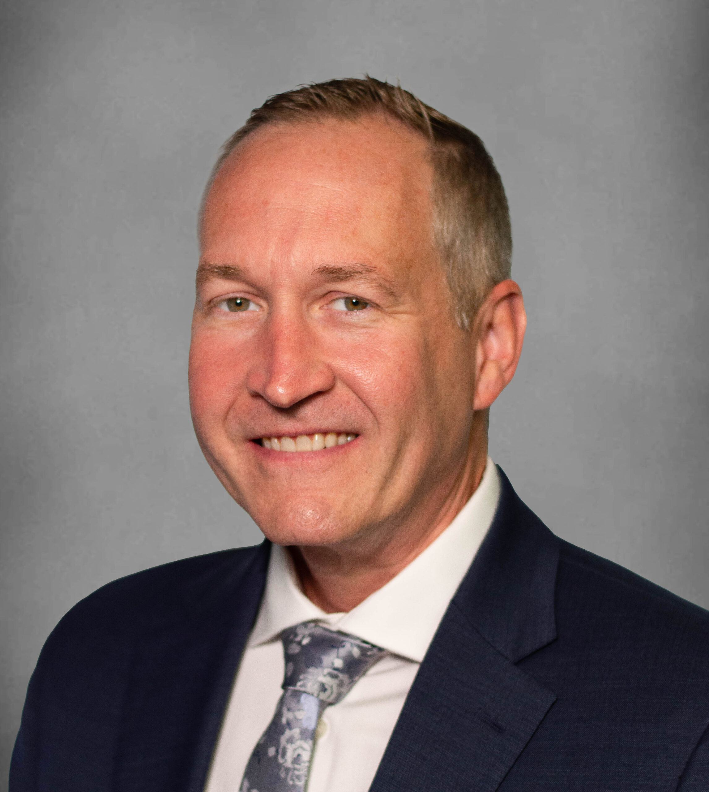 Professional headshot of an orthopaedic care provider (J Davis)