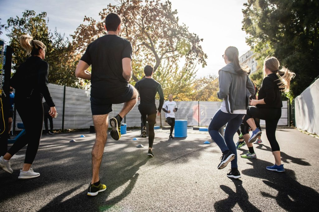 Group of people performing outdoor workout