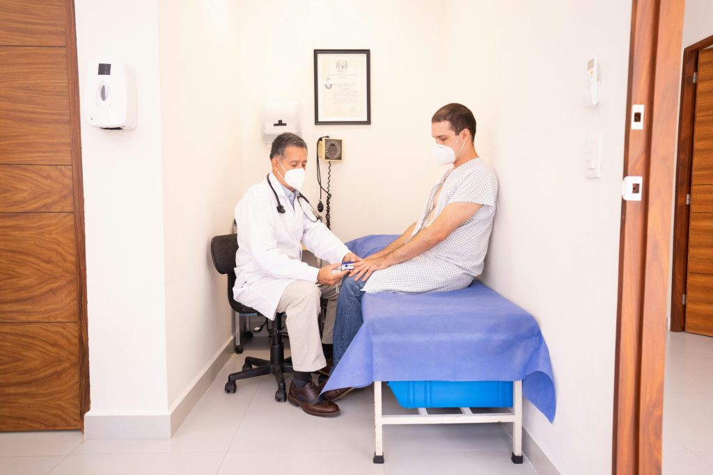 Man receiving blood pressure testing